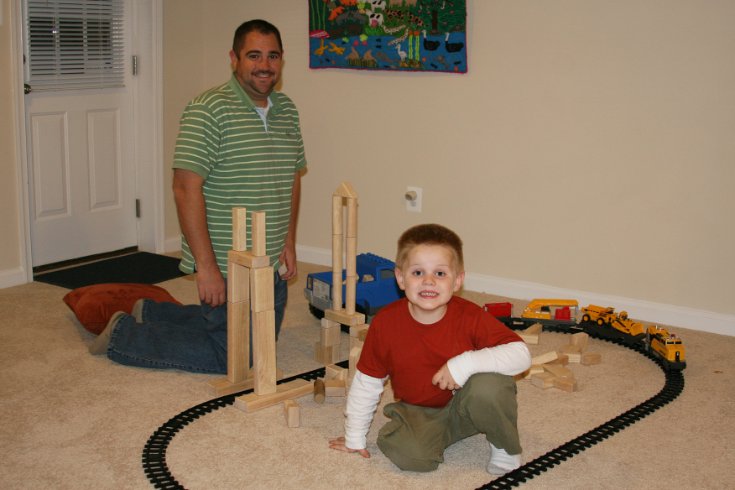 Pete helps to build the train village